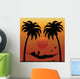 Woman Reading in a Hammock Between Palm Trees Wall Mural