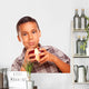 Adorable Hispanic Boy Eating a Large Red Apple Wall Decal