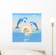 Jumping dolphins in front of a sunset over sea Wall Mural