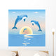 Jumping dolphins in front of a sunset over sea Wall Mural