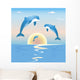 Jumping dolphins in front of a sunset over sea Wall Mural