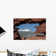 Pikes Peak mountain as seen through a hole in red rocks at Garde Wall Mural