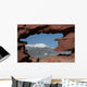 Pikes Peak mountain as seen through a hole in red rocks at Garde Wall Mural
