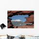 Pikes Peak mountain as seen through a hole in red rocks at Garde Wall Mural