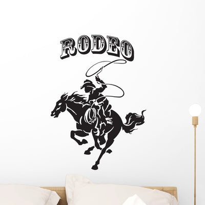 Rodeo Cowboy Silhouette Wall Decal shown on a wall