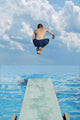 Boy Jumps Into Water Wall Mural
