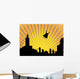 Silhouetted  superhero flying off into the sunset Wall Mural