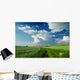 Beautiful Clouds over green fields Wall Mural