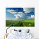 Beautiful Clouds over green fields Wall Mural