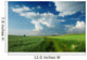 Beautiful Clouds over green fields Wall Mural