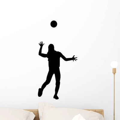 Female Volleyball Silhouette Wall Decal shown on a wall