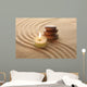 Stack of Pebbles and Light Candle Wall Mural