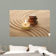 Stack of Pebbles and Light Candle Wall Mural