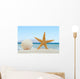 Sea shell and starfish on the beach Wall Mural