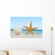 Sea shell and starfish on the beach Wall Mural