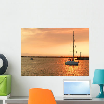 Sailboat Sunset Wall Mural shown on a wall