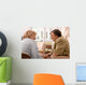 Senior woman is visited  by her doctor or caregiver at home Wall Mural