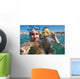 Lovely couple enjoying snorkeling during their vacation Wall Mural