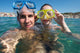 Lovely couple enjoying snorkeling during their vacation Wall Mural