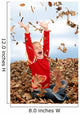 happy seven year old girl playing in pile of leave Wall Mural
