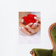 Woman hands with french manicure holding red rose Wall Mural