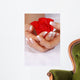 Woman hands with french manicure holding red rose Wall Mural