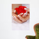 Woman hands with french manicure holding red rose Wall Mural