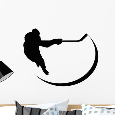 Hockey Player Silhouette Wall Decal shown on a wall