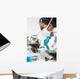 Asian Woman Doctor or Scientist Using a Microscope In Laboratory Wall Mural