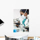 Asian Woman Doctor or Scientist Using a Microscope In Laboratory Wall Mural