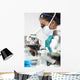 Asian Woman Doctor or Scientist Using a Microscope In Laboratory Wall Mural