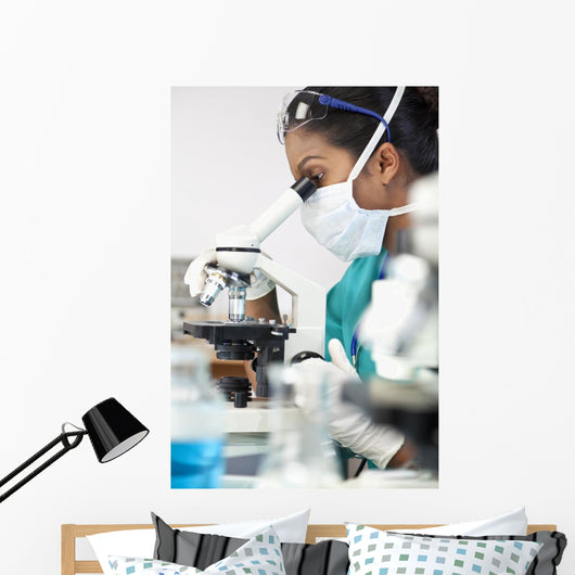 Asian Woman Doctor or Scientist Using a Microscope In Laboratory Wall Mural