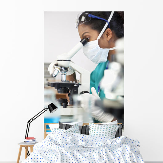 Asian Woman Doctor or Scientist Using a Microscope In Laboratory Wall Mural