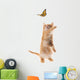 Ginger  kitten playing with a butterfly Wall Decal