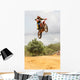 Motorcross Motorcycle Rider Flying through Air Wall Mural