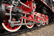 Red wheels of the old express steam train Wall Mural