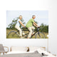Mature couple riding tandem Wall Mural