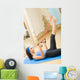 Young happy woman exercising with expander at home Wall Mural
