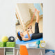 Young happy woman exercising with expander at home Wall Mural