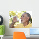 Elderly man using asthma inhaler outdoors Wall Mural