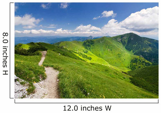 Mountain-ridge and blue sky with white clouds Wall Mural