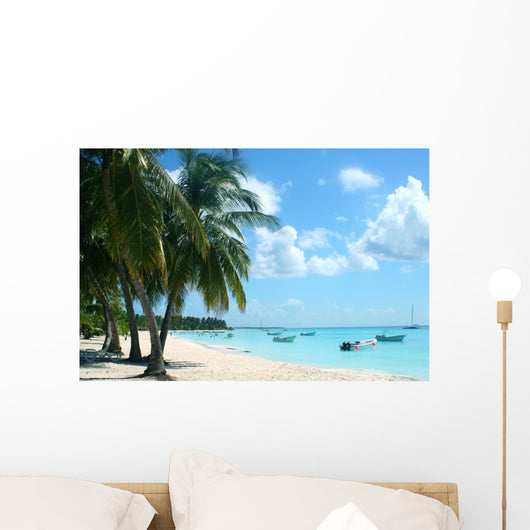 palm trees and boats on tropical island Wall Mural