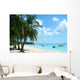 palm trees and boats on tropical island Wall Mural