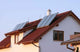 House with Solar Panels on the Roof for Water Heating Wall Mural
