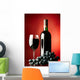 Glass and bottle of red wine. Wall Mural