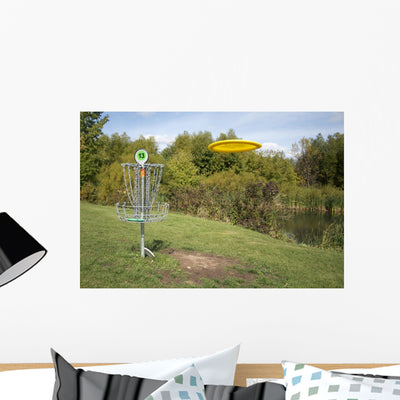 Frisbee Golf with Disc Wall Mural shown on a wall