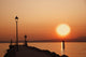 Tramonto sul lago di garda con siloutte di uomo Wall Mural