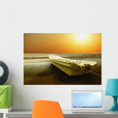 Boat Sits Shore Wall Mural shown on a wall