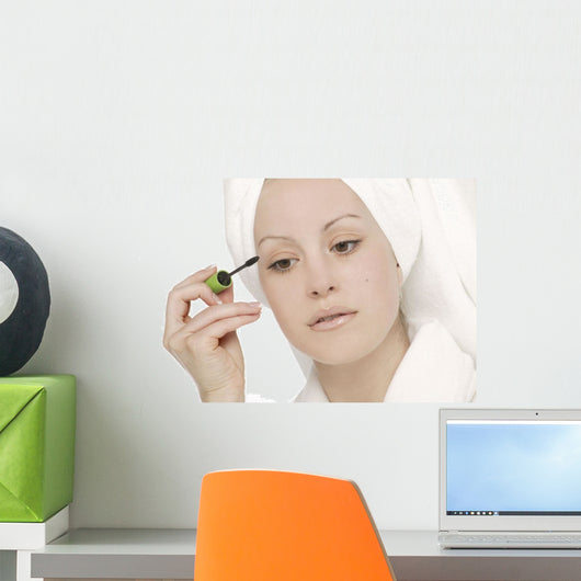 Woman Applying Mascara Wall Mural
