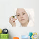 Woman Applying Mascara Wall Mural